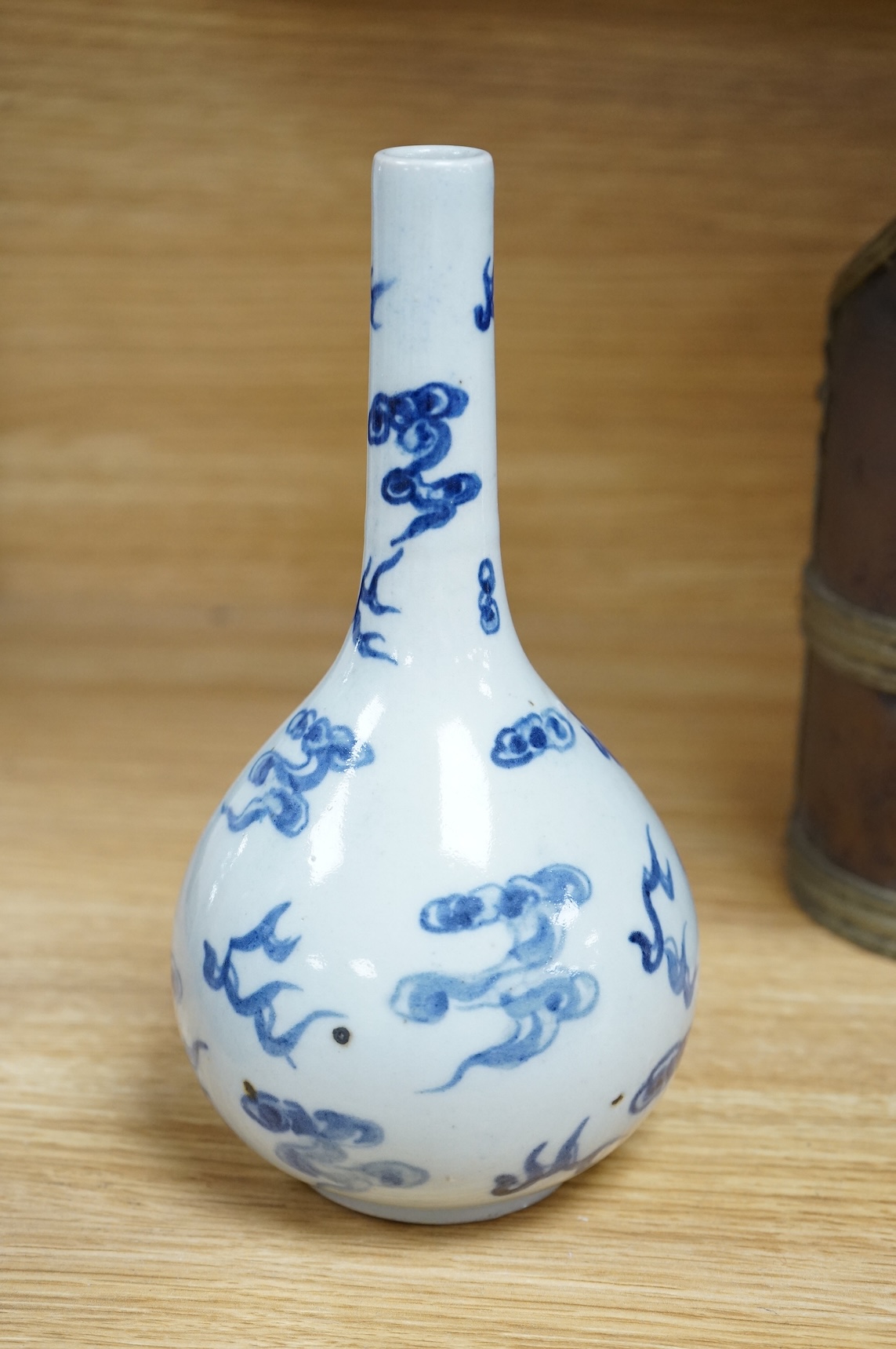A Chinese blue and white bottle vase, a crackle glaze vase and a Tibetan copper and brass ‘monk’ cap’ ewer (3), tallest 21cm